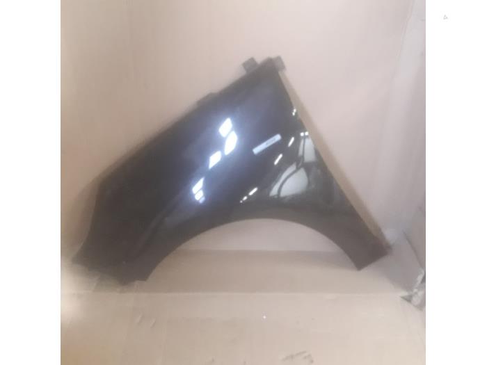 Front wing, left from a Renault Scénic III (JZ) 1.4 16V TCe 130 2011