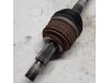 Front drive shaft, left from a Renault Laguna III Estate (KT) 1.5 dCi 110 FAP 2011