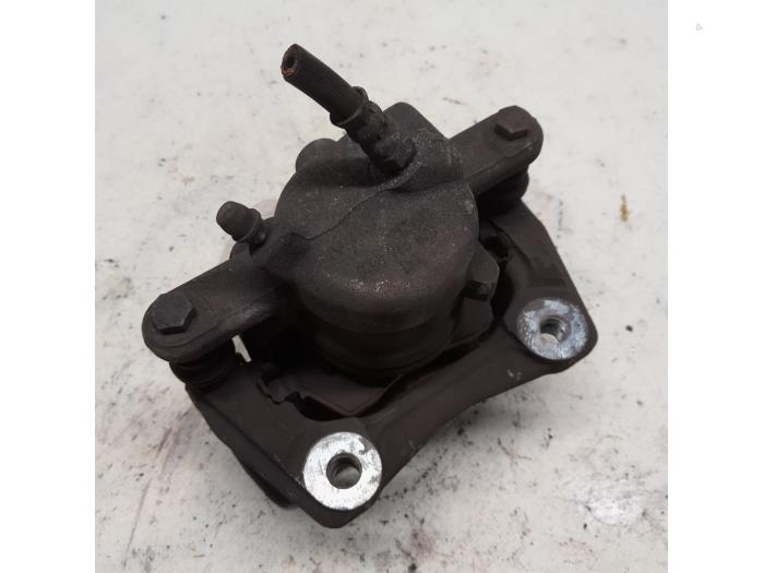 Front brake calliper, left from a Dacia Duster (HS) 1.6 SCe 115 16V 2016