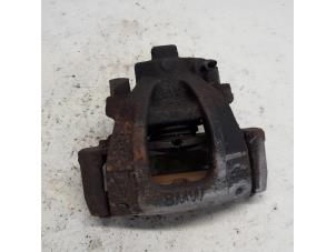 Used Front brake calliper, left BMW Mini One/Cooper (R50) 1.6 16V One Price € 31,50 Margin scheme offered by Reclycar De Boer BV