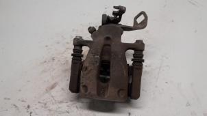 Used Rear brake calliper, left Mini Mini (R56) 1.4 16V One Price € 36,75 Margin scheme offered by Reclycar De Boer BV