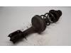 Fronts shock absorber, left from a Renault Twingo II (CN), 2007 / 2014 1.2, Hatchback, 2-dr, Petrol, 1.149cc, 43kW (58pk), FWD, D7F800; EURO4, 2007-03 / 2014-09, CN0D 2008