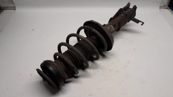 Fronts shock absorber, left from a Opel Insignia Sports Tourer 1.6 Turbo 16V Ecotec 2009
