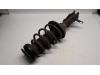 Fronts shock absorber, left from a Opel Insignia Sports Tourer 1.6 Turbo 16V Ecotec 2009