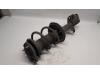 Fronts shock absorber, left from a Toyota Corolla Verso (R10/11) 1.6 16V VVT-i 2004