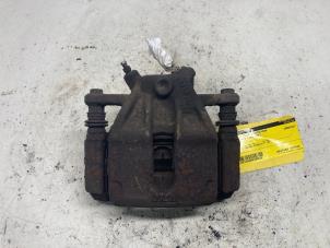 Used Front brake calliper, right Nissan Note (E11) 1.4 16V Price € 26,25 Margin scheme offered by Reclycar De Boer BV