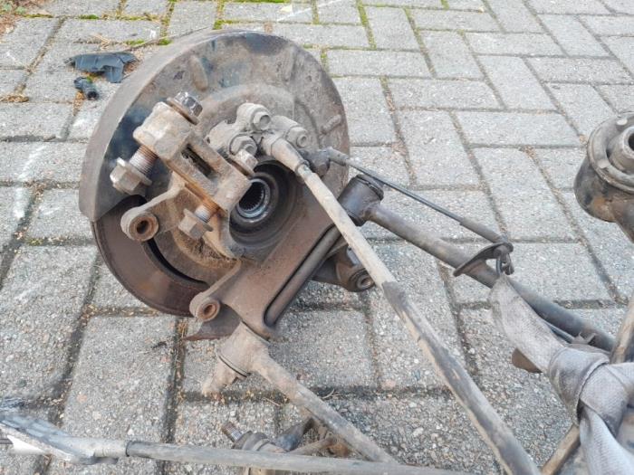 Rear-wheel drive axle Nissan X-Trail 2.2 Di 4x2 - 430198H300 YD22ETI