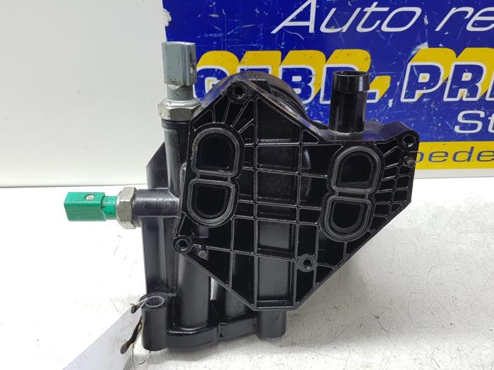 Oil filter housing from a Volkswagen Touran (5T1) 1.6 TDI SCR BlueMotion Technology 2017