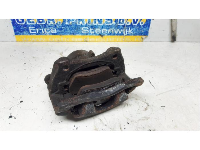 Front brake calliper, left from a Renault Kangoo Express (FW) 1.5 dCi 75 FAP 2015