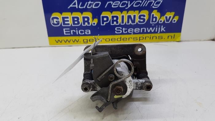 Rear brake calliper, left from a Opel Corsa E 1.3 CDTi 16V ecoFLEX 2015