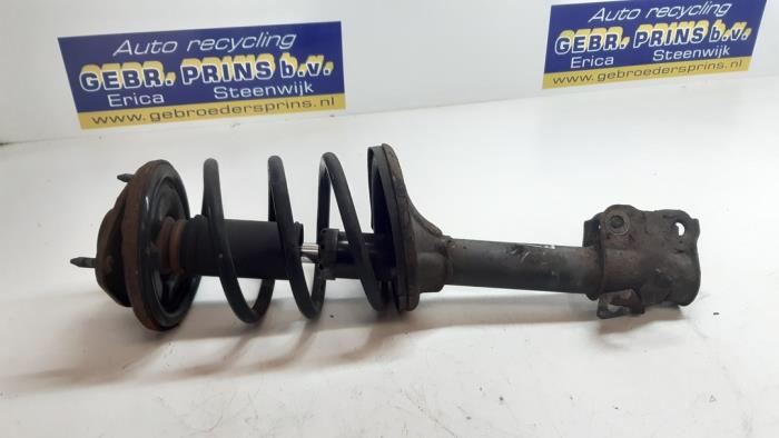 Front shock absorber rod, left from a Mitsubishi Outlander (CU) 2.4 16V 4x4 2006