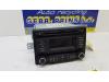 Radio CD player from a Kia Rio III (UB), 2011 / 2017 1.1 CRDi VGT 12V, Hatchback, Diesel, 1.120cc, 55kW (75pk), FWD, D3FA, 2011-09 / 2017-12, UBF5D1; UBF5D3; UBF5D5; UBF5D7 2012