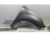 Front wing, right from a Renault Scénic III (JZ), 2009 / 2016 1.5 dCi 105, MPV, Diesel, 1.461cc, 78kW (106pk), FWD, K9K836; K9KJ8, 2009-04 / 2016-09, JZ1W0; JZ3M0; JZ3W0 2009