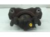 Front brake calliper, left from a Renault Scénic III (JZ) 1.5 dCi 105 2009