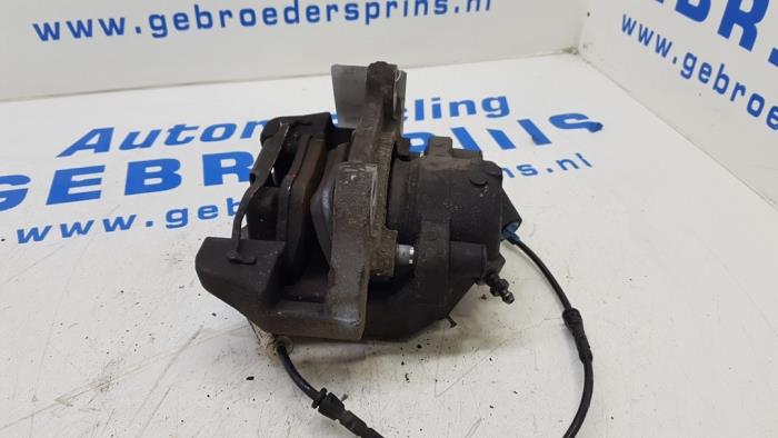 Front brake calliper, left from a BMW 3 serie (E93) 330d 24V 2010