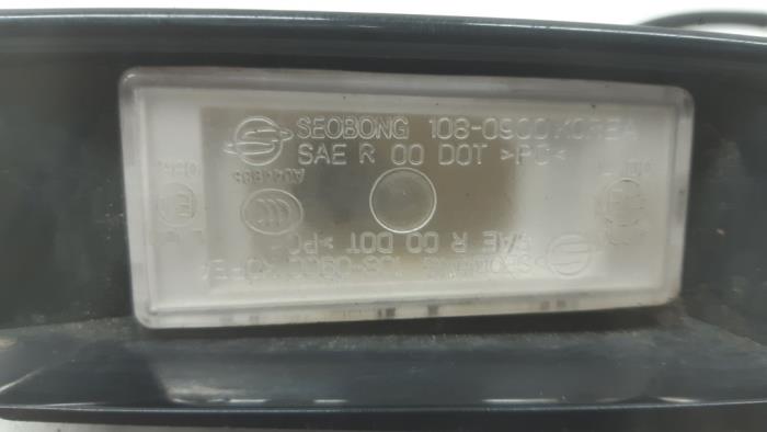 Registration plate light from a SsangYong Rexton W 2.2 RX 220 E-XDI 16V 2WD 2017