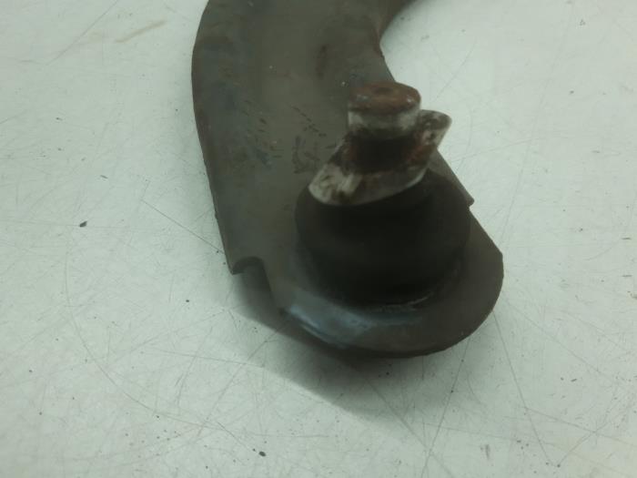 Front lower wishbone, left from a Nissan Micra (K12) 1.2 16V 2005