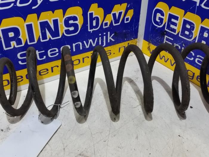 Rear coil spring from a Seat Ibiza IV (6J5) 1.2 TDI Ecomotive 2011