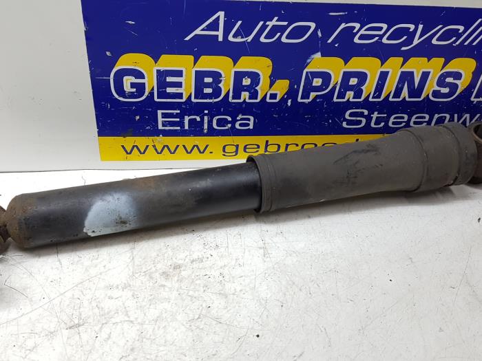 Rear shock absorber, left from a Renault Megane III Grandtour (KZ) 1.5 dCi 110 2012