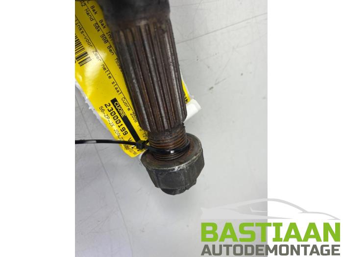 Front drive shaft, left from a Daihatsu Cuore (L251/271/276) 1.0 12V DVVT 2008