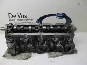 Used Cylinder head Peugeot 205 II (20A/C) 1.8 XLD,XRD,GLD,GRD Price € 160,00 Margin scheme offered by De Vos Autodemontagebedrijf
