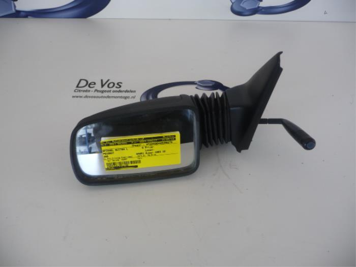 Wing mirror, left from a Peugeot 205 II (20A/C) 1.6 XS,XT,GT Autom. 1993