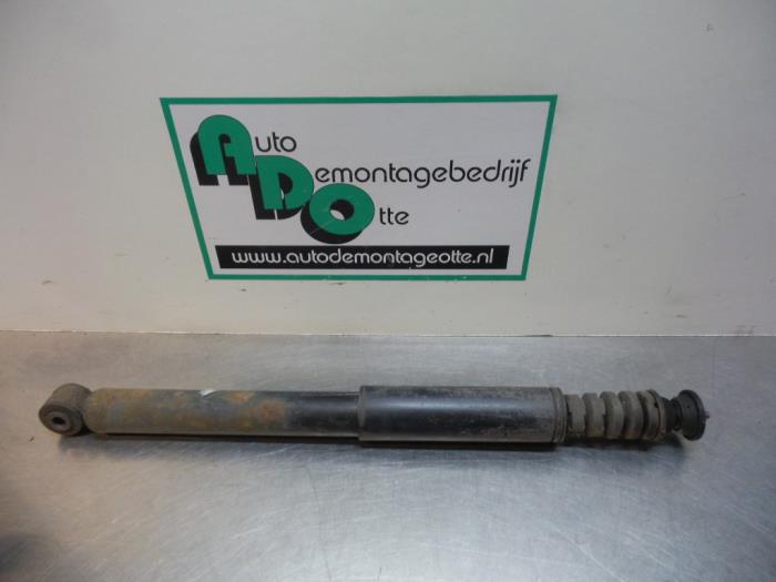 Rear shock absorber, left from a Renault Clio III (BR/CR) 1.2 16V 75 2010