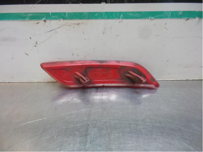 Rear bumper reflector, left from a Ford Focus 2009
