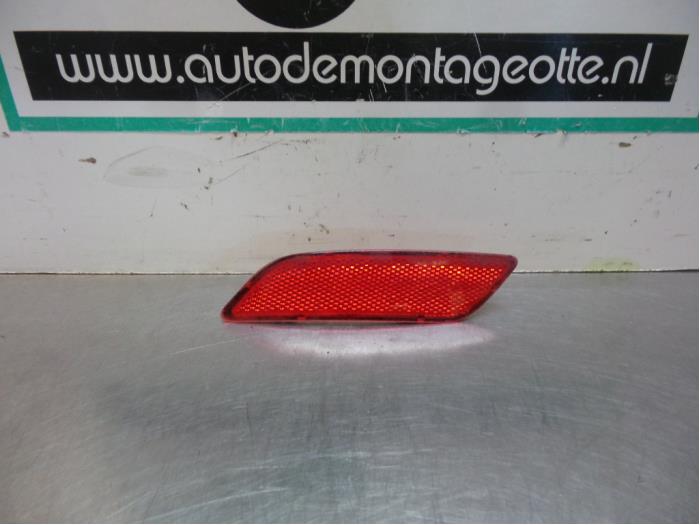 Rear bumper reflector, left from a Ford Focus 2009