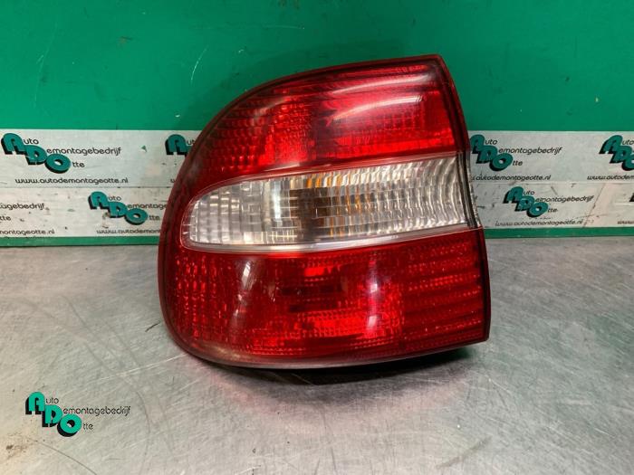 Tail light bulb cover holder