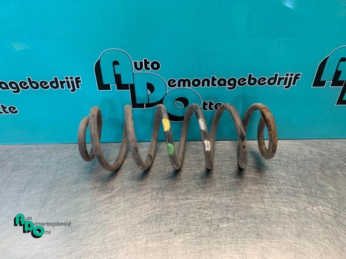 Rear coil spring from a Peugeot 307 CC (3B) 2.0 16V 2003