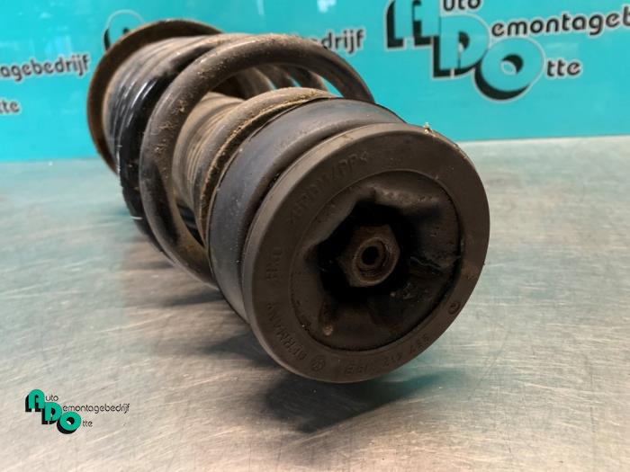 Front shock absorber rod, left from a Volkswagen Golf III Cabrio Restyling (1E7) 1.8 Kat. 2001
