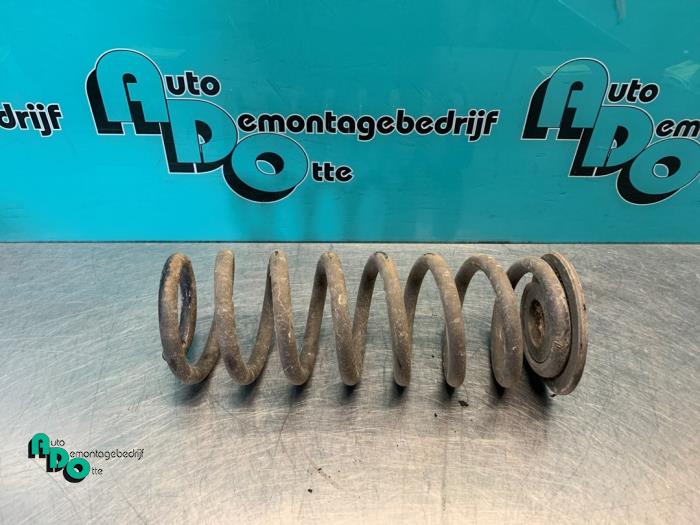 Rear coil spring from a Volkswagen Golf VII (AUA) 1.2 TSI 16V 2012