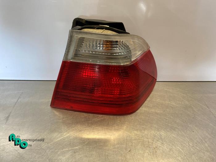 Tail light bulb cover holder