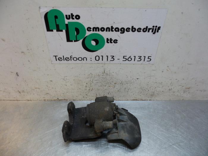 Front brake calliper, left from a Seat Arosa (6H1) 1.4i 2001