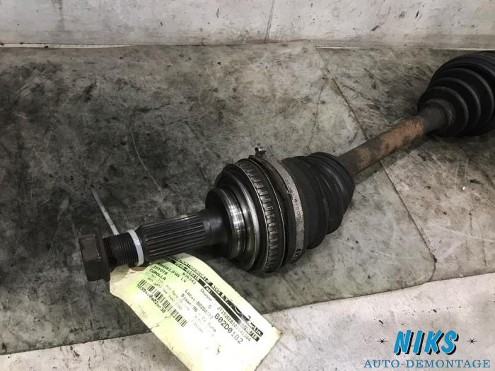 Front drive shaft, left from a Toyota Corolla (E11) 1.3 16V 1999