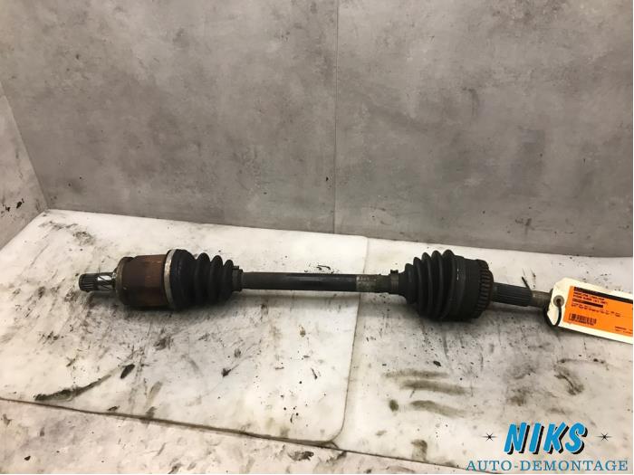 Front drive shaft, left from a Nissan Almera (N16) 1.5 16V 2007