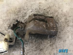 Used Rear brake calliper, left Renault Megane II (BM/CM) 1.4 16V 98 Price on request offered by Niks autodemontage
