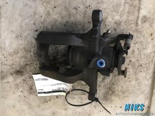 Used Rear brake calliper, left Opel Astra J Sports Tourer (PD8/PE8/PF8) 1.4 16V ecoFLEX Price on request offered by Niks autodemontage