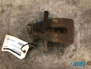 Used Rear brake calliper, left Renault Modus/Grand Modus (JP) 1.4 16V Price on request offered by Niks autodemontage