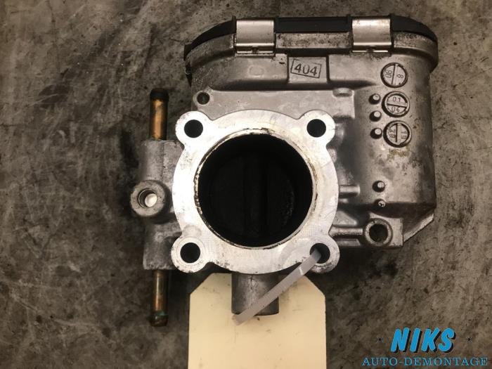 Throttle body from a Opel Astra H (L48) 1.4 16V Twinport 2004