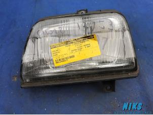 Used Headlight, left Daihatsu Cuore (L251/271/276) 850,44 Price on request offered by Niks autodemontage