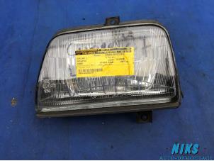 Used Headlight, left Daihatsu Cuore (L251/271/276) 850,44 Price on request offered by Niks autodemontage