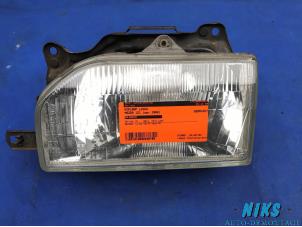 Used Headlight, left Mazda 121 (DA) 1.1 L,DX,LS Price on request offered by Niks autodemontage