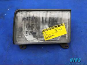 Used Headlight, left Mazda E-Klasse Price on request offered by Niks autodemontage