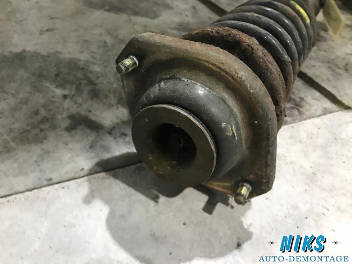 Front shock absorber rod, left from a Opel Agila (A) 1.2 16V 2003