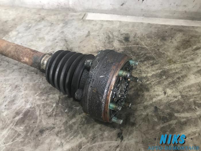 Front drive shaft, left from a Volkswagen Polo 1999
