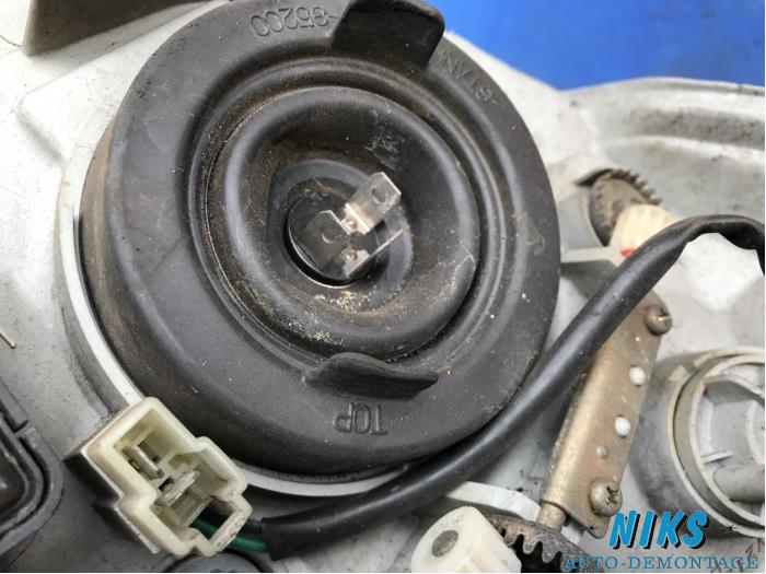 Headlight, left Daihatsu Sirion/Storia 1.0 12V 02002011