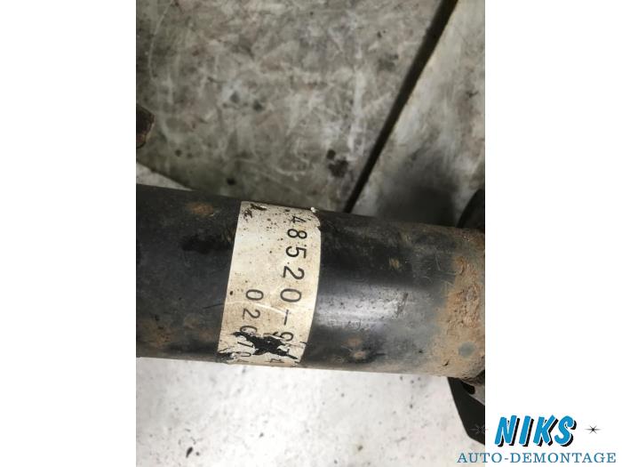 Front shock absorber rod, left from a Daihatsu Young RV 2002