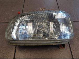 Used Headlight, left Daihatsu Cuore (L251/271/276) 850,Domino Price € 25,00 Margin scheme offered by Autosloopbedrijf H.C.Stouten